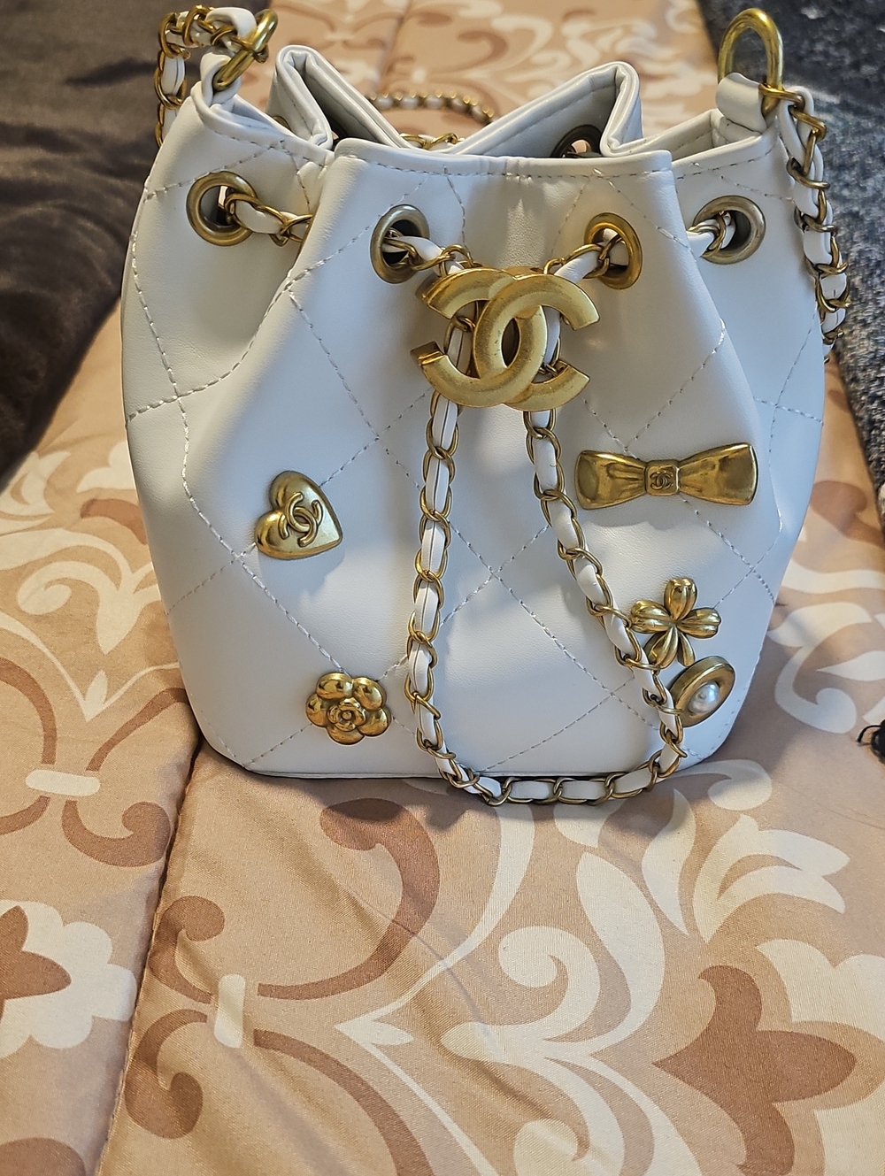 Inspired White Quilted Mini Drawstring Bucket Bag with Gold Hardware Accents